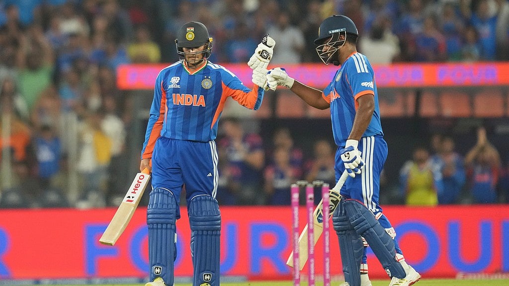 AP Photo/Rafiq Maqbool : India's Abhishek Sharma celebrates his fifty runs with batting partner India's Sanju Samson during the T20 World Cup cricket final match between India and New Zealand in Ahmedabad, India, Sunday, March 8, 2026.