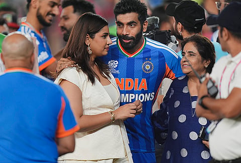 India's Jasprit Bumrah celebrates with wife Sanjana Ganesan and others after winning the ICC Men's T20 World Cup 2026, at Narendra Modi Stadium, in Ahmedabad, Gujarat.