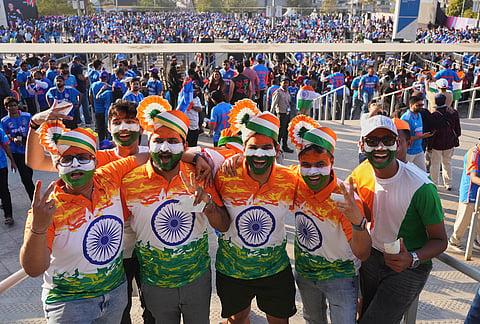 Indian cricket fans pose for photograph as they arrive for the T20 World Cup cricket final match between India and New Zealand in Ahmedabad.