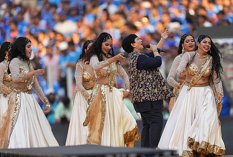 Indian singer Falguni Pathak, dressed in black, performs during the closing ceremony of the T20 World Cup cricket final match between India and New Zealand in Ahmedabad.