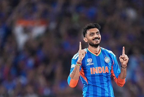 India's Axar Patel celebrates the wicket of New Zealand's Daryl Mitchell during the T20 World Cup cricket final match between India and New Zealand in Ahmedabad.
