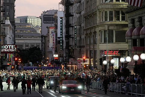 Olympic gold medalist and Grand Marhsal Eileen Gu, bottom middle, waves during the Chinese New Year Parade in San Francisco.