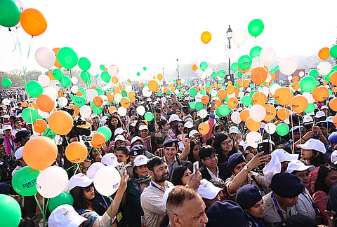 People take part in a 'Shakti Walk' organised by the Ministry of Women and Child Development on the occasion of International Women's Day, at Kartavya Path in New Delhi.