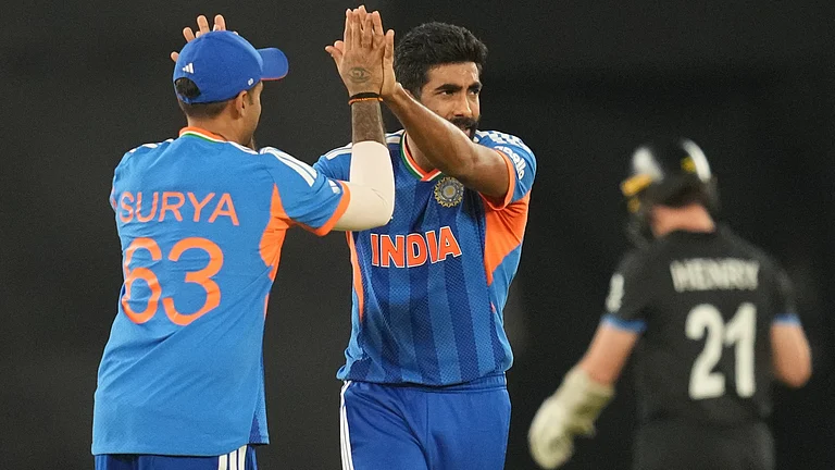 India's Jasprit Bumrah celebrates the wicket of New Zealand's Matt Henry, right, during the T20 World Cup cricket final match between India and New Zealand in Ahmedabad, India, Sunday, March 8, 2026. - | Photo: AP/Rafiq Maqbool