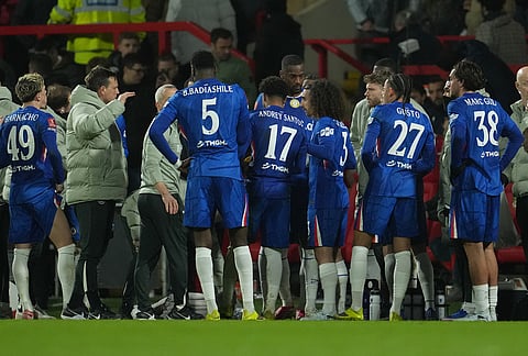 Chelsea players huddle before the extra time during the fifth round FA Cup soccer match between Wrexham and Chelsea in Wrexham, Wales.