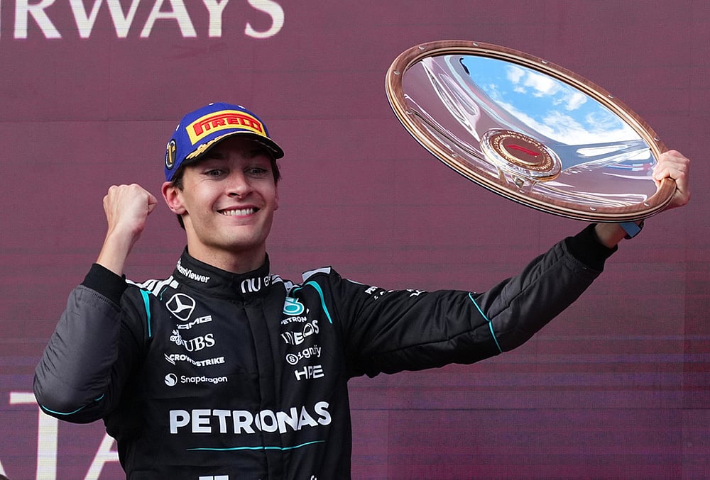 Mercedes driver George Russell of Britain celebrates after winning the Australian Formula One Grand Prix at Albert Park, in Melbourne, Australia. - | Photo: AP/Scott Barbour
