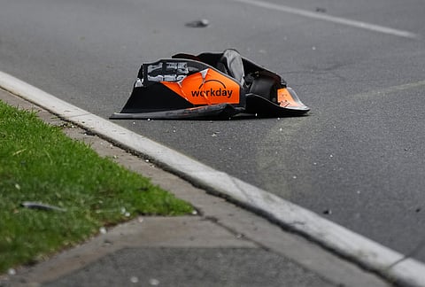 A part belonging to McLaren driver Oscar Piastri of Australia's car sits on the track after he crashe don the formation lap ahead of the Australian Formula One Grand Prix at Albert Park, in Melbourne, Australia.