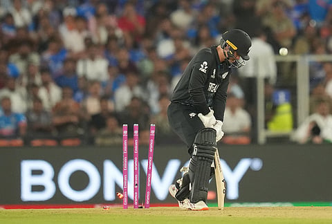 New Zealand's Mark Chapman bowled out by India's Hardik Pandya during the T20 World Cup cricket final match between India and New Zealand in Ahmedabad.