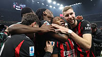 File : AC Milan players celebrate a goal.