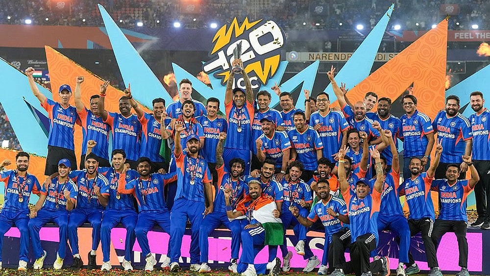 | Photo: PTI/Shailendra Bhojak : India's captain Suryakumar Yadav lifts the tournament trophy with teammates after winning the ICC Men's T20 World Cup 2026, at Narendra Modi Stadium, in Ahmedabad, Gujarat.
