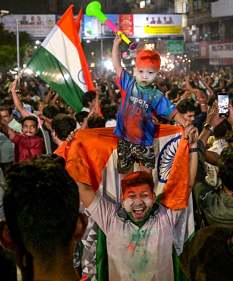 Cricket fans celebrate India's victory over New Zealand in the ICC Men's T20 World Cup 2026, in Nagpur, Maharashtra.