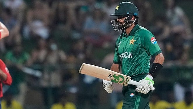 | Photo: AP/Eranga Jayawardena : Pakistan's Babar Azam leaves the ground after losing his wicket as England's Jamie Overton, left, celebrates with teammates during the T20 World Cup cricket match between England and Pakistan in Pallekele, Sri Lanka.