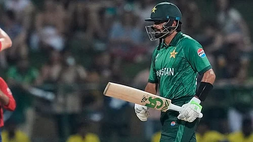 | Photo: AP/Eranga Jayawardena : Pakistan's Babar Azam leaves the ground after losing his wicket as England's Jamie Overton, left, celebrates with teammates during the T20 World Cup cricket match between England and Pakistan in Pallekele, Sri Lanka.