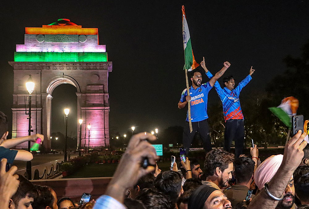 | Photo: PTI : Cricket fans celebrate after India defeated New Zealand to win the ICC Men's T20 World Cup 2026 final near India Gate, in New Delhi.