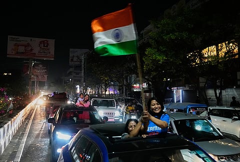 Cricket fans celebrate India's win in the T20 World Cup cricket final match against New Zealand, in Guwahati.