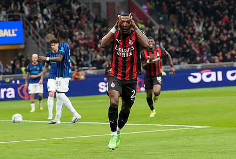 AC Milan's Pervis Estupinan celebrates after scoring the opening goal during the Serie A soccer match between AC Milan and Inter Milan, in Milan, Italy.
