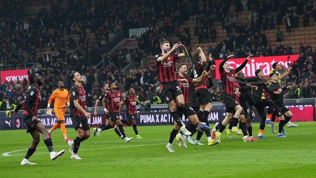 AP : AC Milan players celebrate after winning their Serie A match against Inter in Milan, Italy.