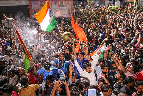 Cricket fans celebrate after India won the ICC Men's T20 World Cup 2026, in Prayagraj, Uttar Pradesh.