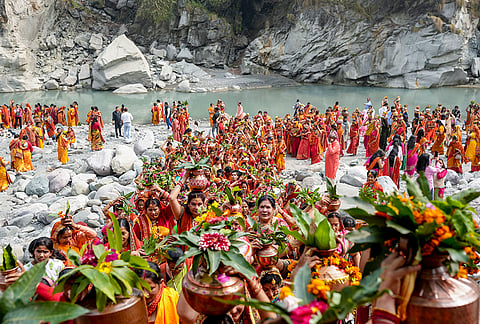 Devotees take part in a ‘kalash yatra’ on the ‘Sheetala Ashtami’ festival, in Ranibagh.