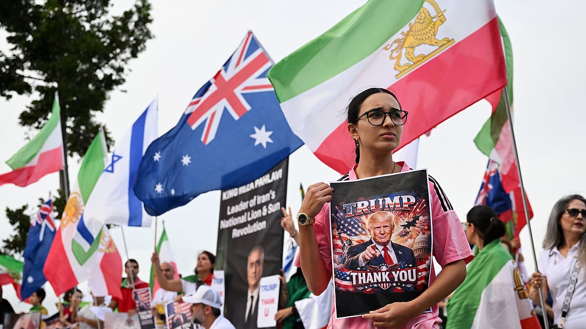 Iranians in Australia react with flags and political signs outside the stadium ahead of the Women's Asia Cup soccer match between Australia and Iran in Robina, Australia, Thursday, March 5, 2026.  - | Photo: AP/DAVE HUNT