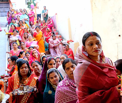 Women gather at a temple to perform rituals on the occasion of 'Sheetala Saptami', in Bhopal, Madhya Pradesh.