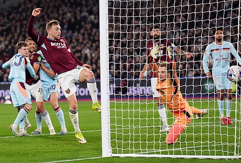 West Ham United's Jarrod Bowen scores during the English FA Cup fifth round soccer match between West Ham United and Brentford in London.