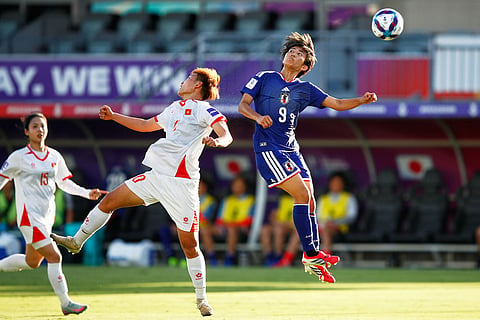 Japan's Riko Ueki, right, and Vietnam's Trần Thị Hải Linh compete to head the ball during the Women's Asian Cup soccer match between Japan and Vietnam in Perth, Australia.