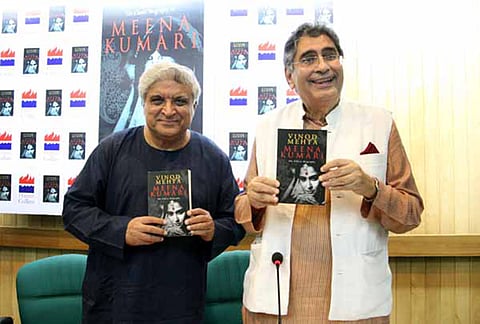 Vinod Mehta, Editorial Chairman of Outlook Group, with Javed Akhtar, poet, lyricist and scriptwriter, during his book launch in New Delhi on Oct 4, 2013.