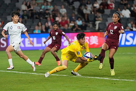 Taiwan's goalkeeper Cheng Ssu-yu grabs the ball to make save during the Women's Asian Cup soccer match between India and Taiwan in Sydney.