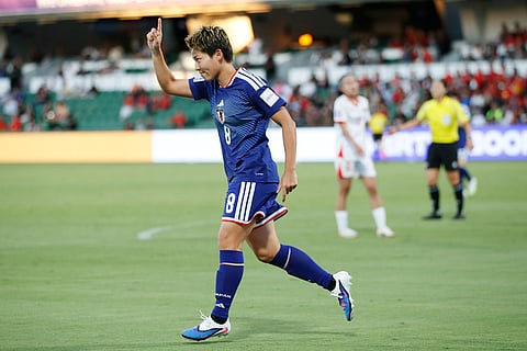 Japan's Kiko Seike celebrates after scoring her team's fourth goal during the Women's Asian Cup soccer match between Japan and Vietnam in Perth, Australia.
