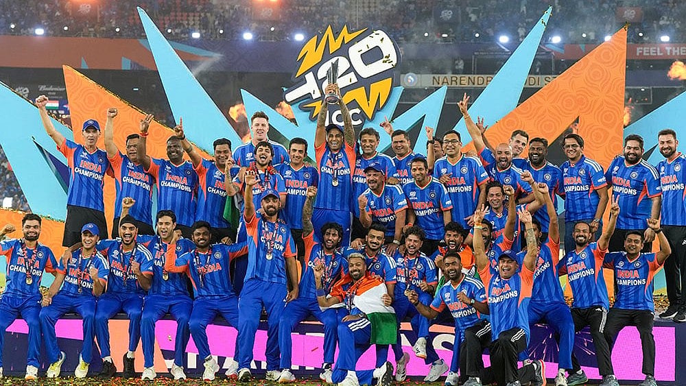 | Photo: PTI/Shailendra Bhojak : India's captain Suryakumar Yadav lifts the tournament trophy with teammates after winning the ICC Men's T20 World Cup 2026, at Narendra Modi Stadium, in Ahmedabad, Gujarat.
