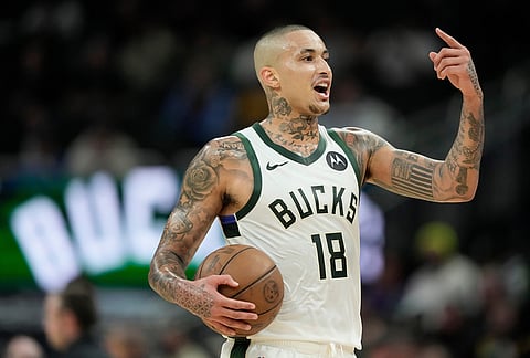 Milwaukee Bucks' Kyle Kuzma reacts to a call during the first half of an NBA basketball game against the Phoenix Suns in Milwaukee.