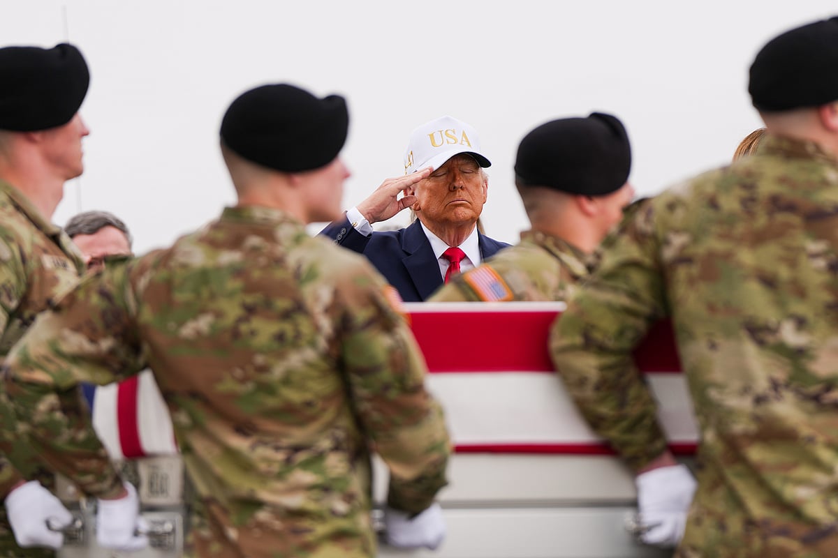 AP/ Julia Demaree Nikhinson : President Donald Trump salutes as an Army carry team moves a flag-draped transfer case with the remains of Sgt. Declan Coady, 20, of West Des Moines, Iowa, who was killed in a drone strike at a command center in Kuwait after the U.S. and Israel launched its military campaign against Iran, during a casualty return