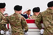 AP/ Julia Demaree Nikhinson : President Donald Trump salutes as an Army carry team moves a flag-draped transfer case with the remains of Sgt. Declan Coady, 20, of West Des Moines, Iowa, who was killed in a drone strike at a command center in Kuwait after the U.S. and Israel launched its military campaign against Iran, during a casualty return