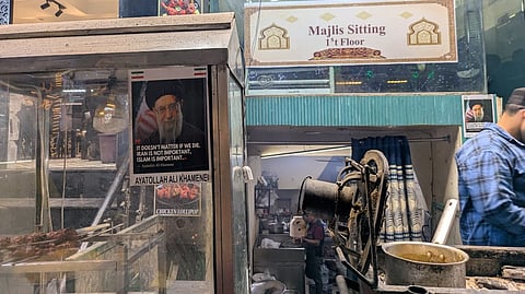 Poster of Khamenei pasted on the front of a restaurant in Shaheen Bagh, Chalees Futa.