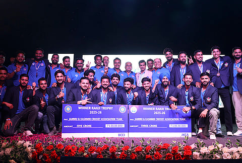 BCCI President Mithun Manhas with Jammu and Kashmir's cricket team poses for photographs during team's felicitation ceremony after winning the Ranji Trophy 2026 tournament, in Jammu.
