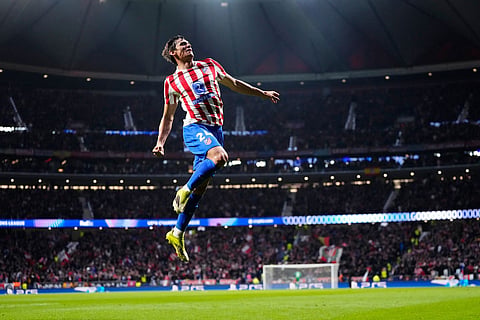 Atletico Madrid's Robin Le Normand celebrates after scoring his side's fourth goal during the first leg of the Champions League round of 16 soccer match between Atletico Madrid and Tottenham in Madrid, Spain.