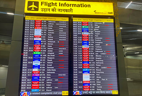An information display board shows cancelled flights at Indira Gandhi International Airport, in New Delhi. Several flights were cancelled due to the ongoing conflict in the Middle East. 