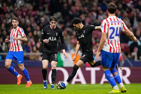 Tottenham's Dominic Solanke scores his side's second goal during the first leg of the Champions League round of 16 soccer match between Atletico Madrid and Tottenham in Madrid, Spain.