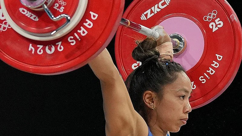 File/AP : Mirabai Chanu Saikhom of India competes during the women's 49kg weightlifting event at the 2024 Summer Olympics in Paris, France.