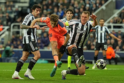 Barcelona's Fermin Lopez gets in a shot during the Champions League round of 16 first leg soccer match between Newcastle United and Barcelona in Newcastle, England.