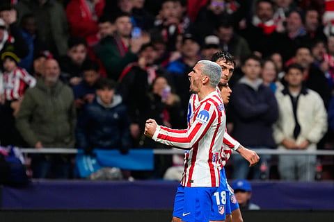 Atletico Madrid's Antoine Griezmann celebrates after scoring his side's second goal during the first leg of the Champions League round of 16 soccer match between Atletico Madrid and Tottenham in Madrid, Spain.