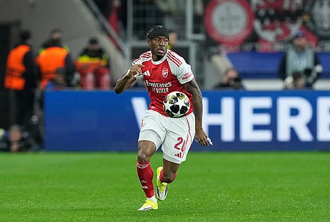 Arsenal's Noni Madueke controls the ball during the Champions League round of 16 first leg soccer match between Bayer Leverkusen and Arsenal FC in Leverkusen, Germany.