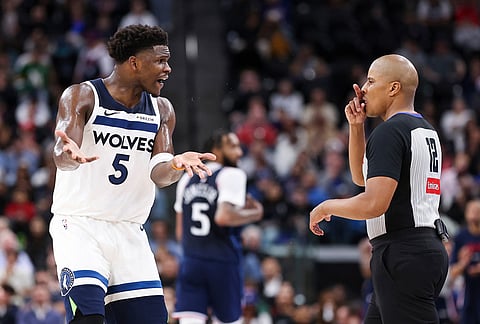 Minnesota Timberwolves guard Anthony Edwards (5) reacts towards referee CJ Washington (12) during the second half of an NBA basketball game against the Los Angeles Clippers, Wednesday, March 11, 2026, in Inglewood, California.