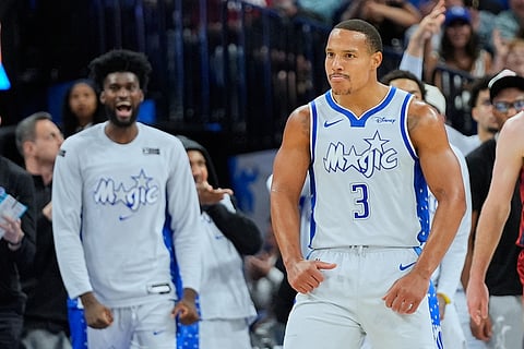 Orlando Magic guard Desmond Bane (3) reacts after sinking a 3-point shot against the Cleveland Cavaliers during the second half of an NBA basketball game in Orlando, Fla.