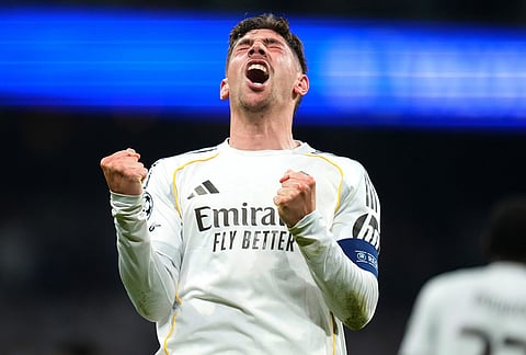 Real Madrid's Federico Valverde celebrates after scoring during a first leg round of 16 Champions League soccer match between Real Madrid and Manchester City in Madrid, Spain.