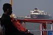 Tensions In Strait Of Hormuz: The Hidden Economic Risk For India Rafiq Maqbool : Liberia-flagged tanker Shenlong Suezmax, carrying crude oil from Saudi Arabia, that arrived clearing the Strait of Hormuz, is seen at the Mumbai Port in Mumbai, India, Thursday, March 12, 2026. (AP Photo/Rafiq Maqbool)