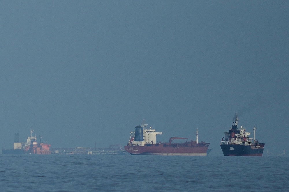 | Photo: AP/Altaf Qadri : Oil tankers and cargo ships line up in the Strait of Hormuz as seen from Khor Fakkan, United Arab Emirates.