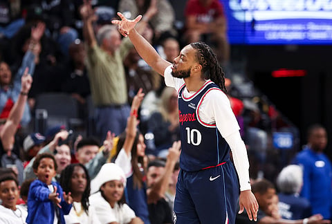 Los Angeles Clippers guard Darius Garland (10) gestures after making a three point basket during the second half of an NBA basketball game against the Minnesota Timberwolves, in Inglewood, California.