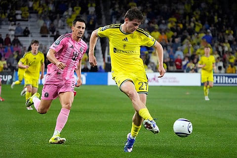 Nashville SC midfielder Reed Baker-Whiting (27) passes the ball away from Inter Miami forward Tadeo Allende, second from left, in the first half of a CONCACAF Champions Cup Round of 16 soccer match in Nashville, Tenn.
